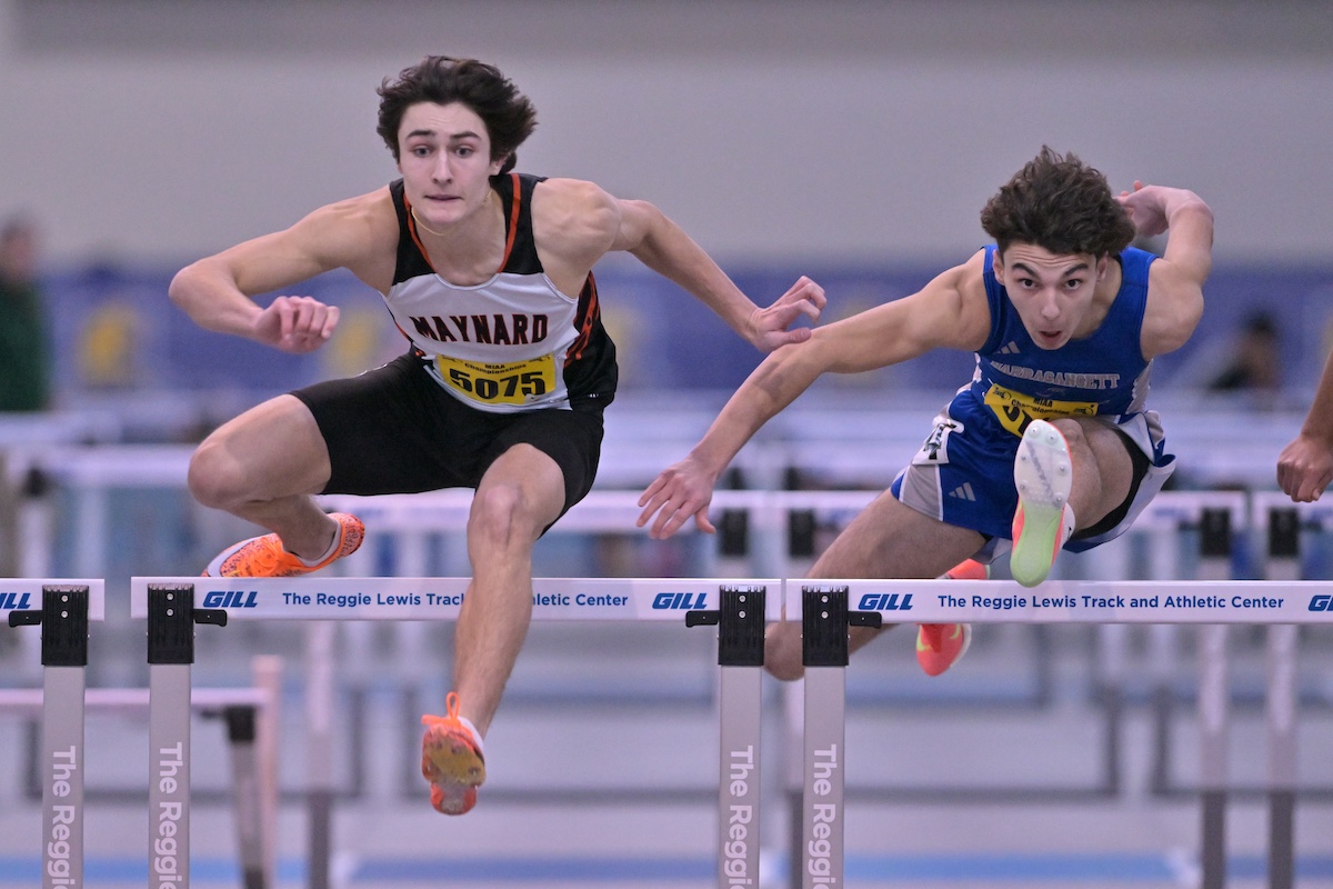 Alex Gwozdz jumping the hurdles