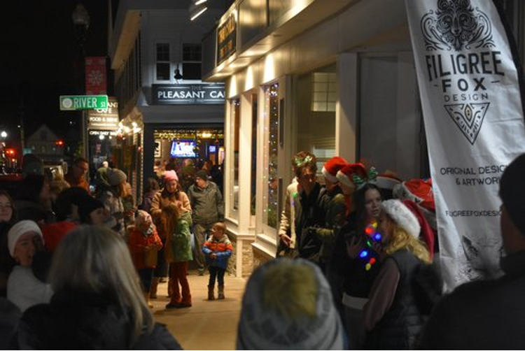 Residents Enjoying The Holiday Stroll
